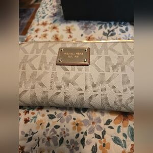 Michael Kors  Monogram Coated Canvas Zip around wallet.